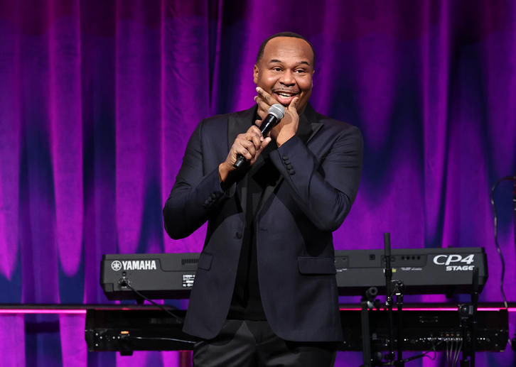 Comedian Roy Wood Jr. performing onstage. 