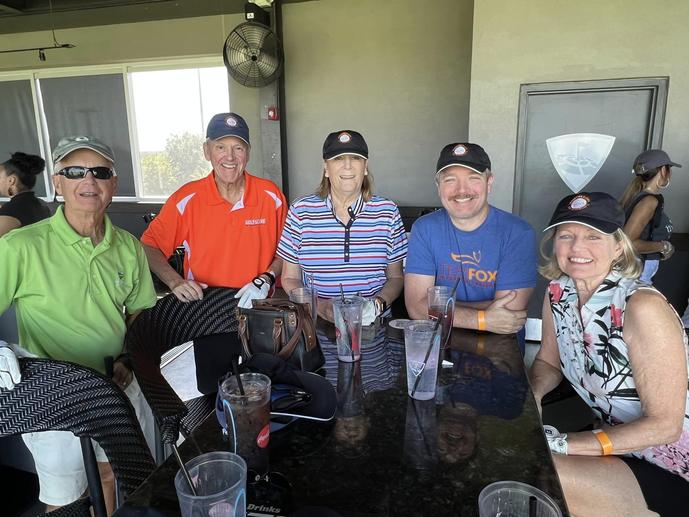 Harmon family smiling at a table
