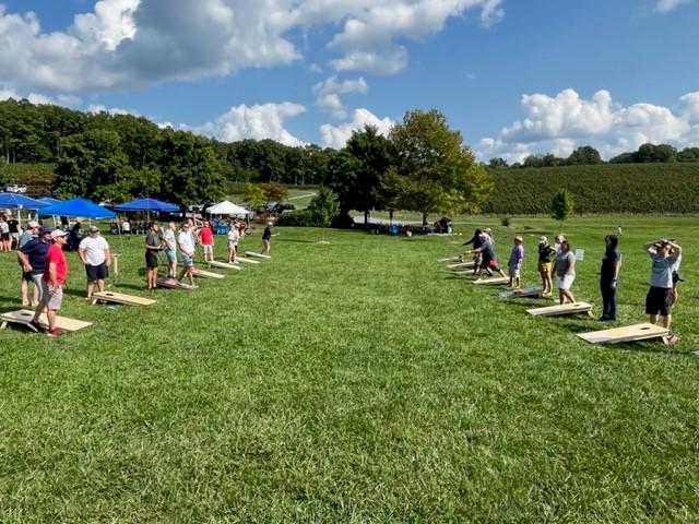 Teams participating in a game of cornhole