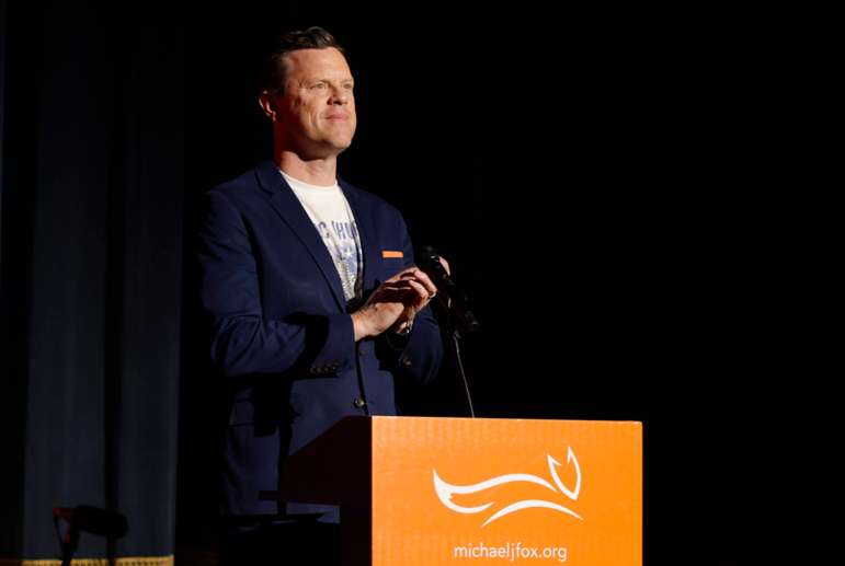Willie Geist gives remarks on stage at the 2026 "A County Thing Happened on the Way to Cure Parkinson's" fundraiser.