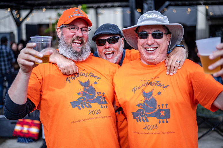 Group of three laughing at the camera