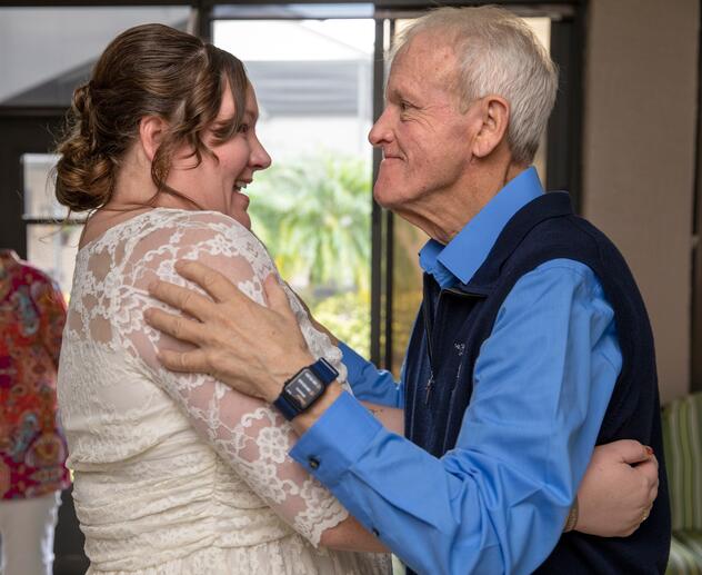 Kate smiling and hugging her late father, Bob Harmon.