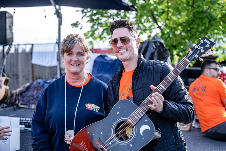 Smiling pair with a guitar