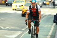 Alejandro Carcano biking on the streets of New York City. 