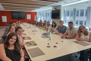 MJFF's summer Interns sitting around the table in a conference room.