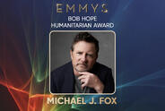 Promotional graphic for the Emmy’s Bob Hope Humanitarian Award featuring a portrait of Michael J. Fox on a blue background with light streaks.