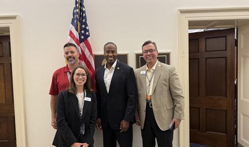 From left to right: Marine Corps veteran Rich Pointe, Kristin Rossi of the Michigan Parkinson Foundation, Representative John James (R-MI-10) and Marine Corps veteran Nate Jolliff at the 2025 Parkinson's Policy Forum on Capitol Hill.