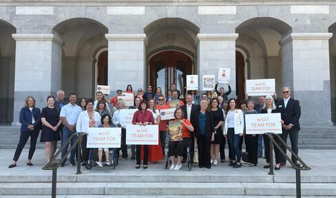Group That Includes Parkinson’s Patients, Advocates, Care Partners and Others Assembling on Steps of California State Capitol.