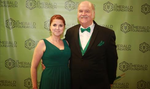 Two people smiling at camera