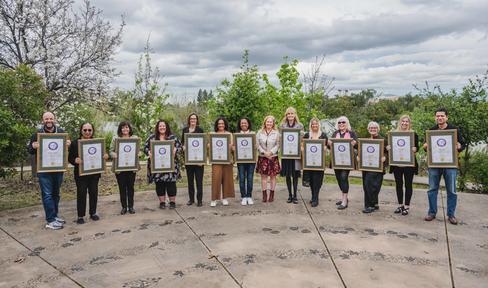 Denise Coley, second from left, receives a 2024 Woman of the Year Award from her state representative, California Assemblymember Gail Pellerin