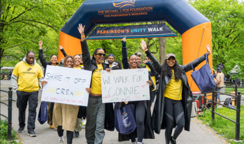 A group celebrates at the finish line of the 2026 Parkinson's Unity Walk.