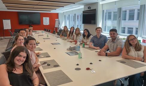 MJFF's summer Interns sitting around the table in a conference room.