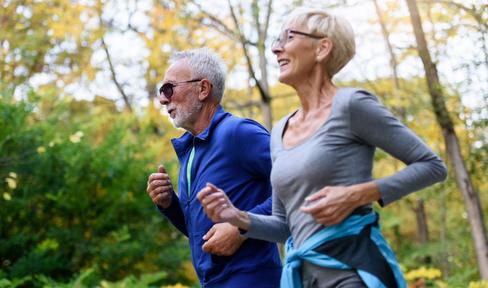couple jogging in the forest