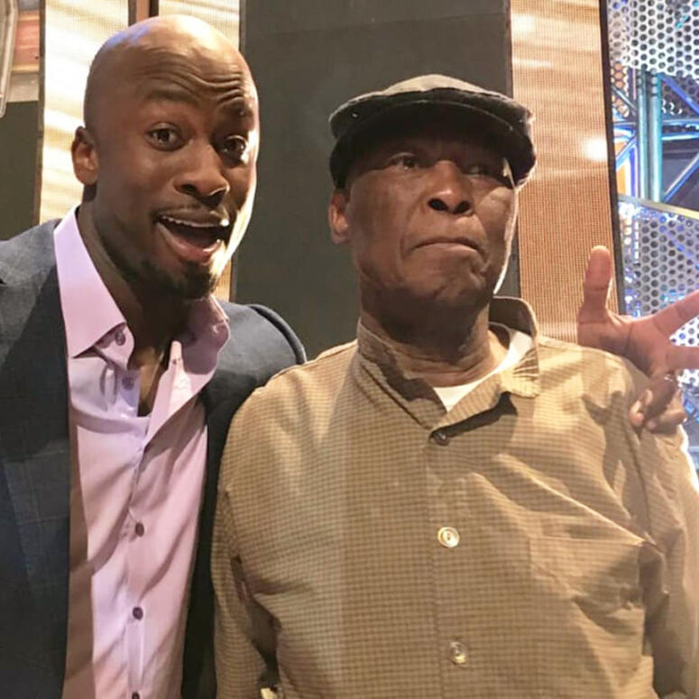 Akbar Gbajabiamila and his father on the set of American Ninja Warrior show