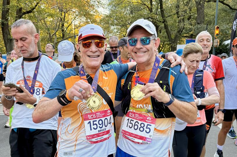 John with his 2025 NYC Marathon medal.