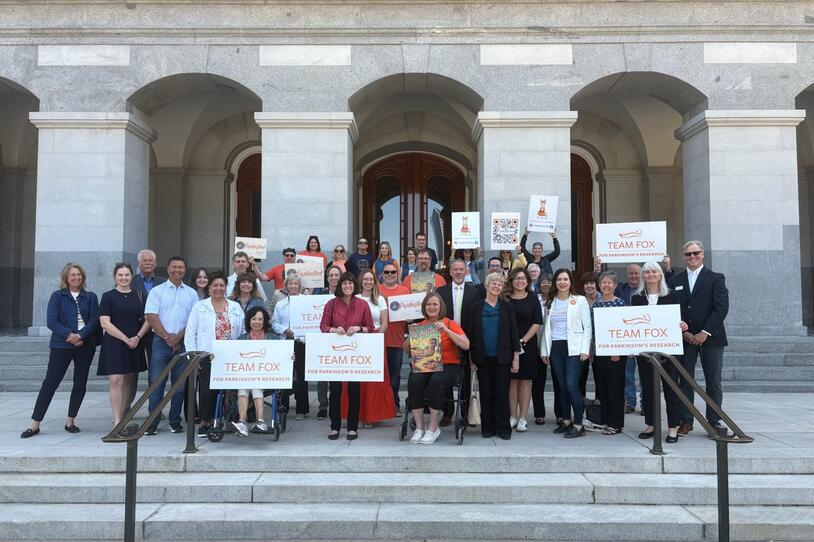Group That Includes Parkinson’s Patients, Advocates, Care Partners and Others Assembling on Steps of California State Capitol.
