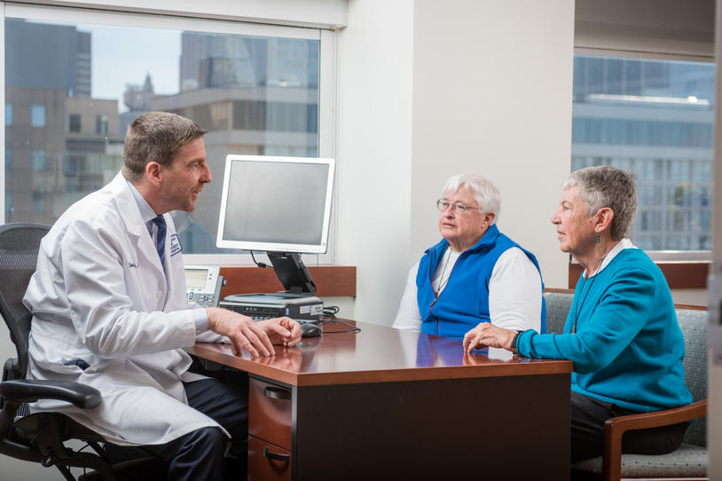 Doctor and two people in office