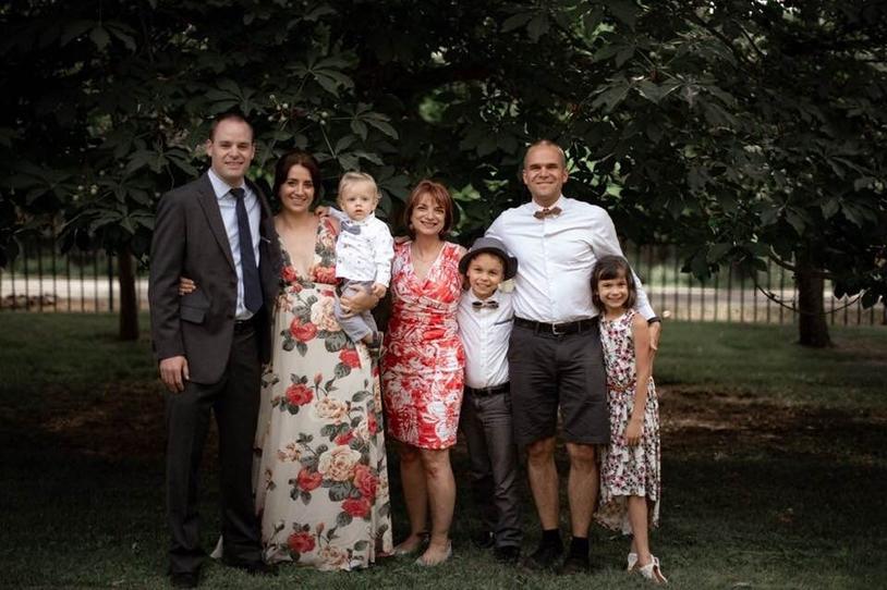 People in formal attire smiling at camera