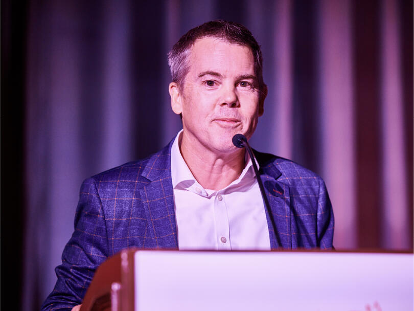Mark Frasier, PhD Chief Scientist  Research Programs, speaking at a podium
