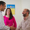 Doctor and two people in clinic room