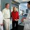 Researchers talking with patients