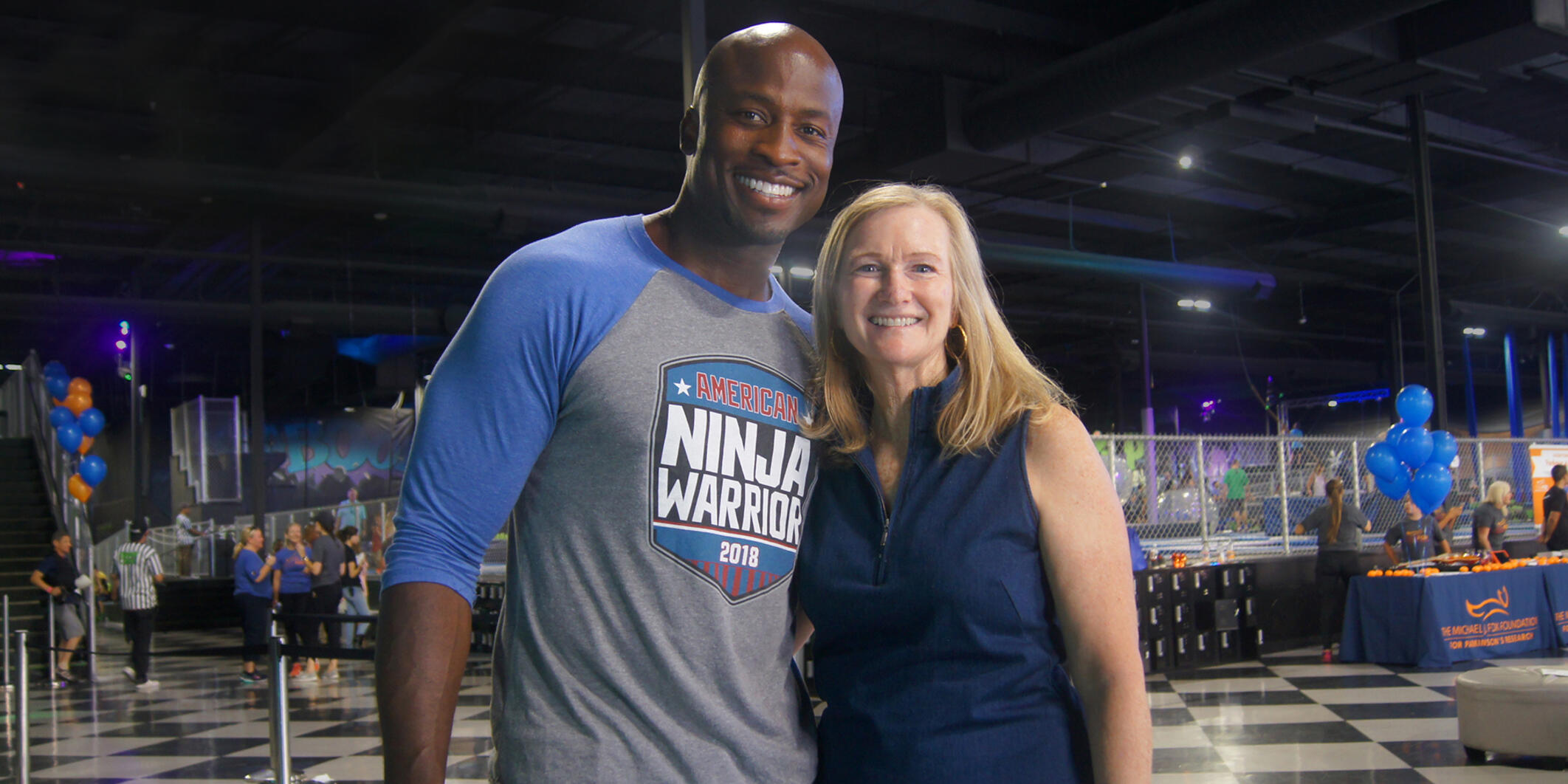 Akbar Gbajabiamila with MJFF Co-Founder and CEO Deborah W. Brooks