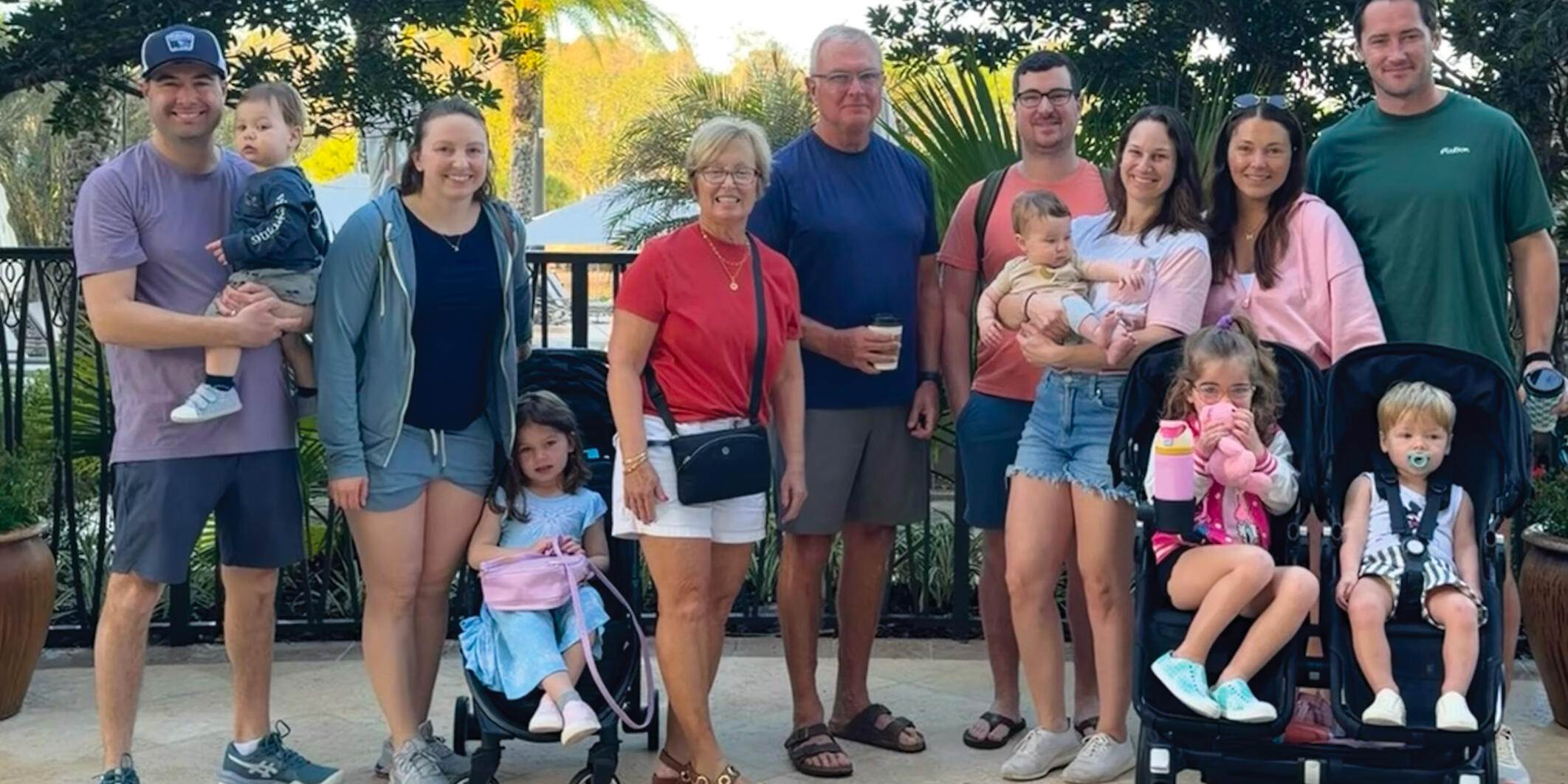 a family stands together outdoors for a group photo
